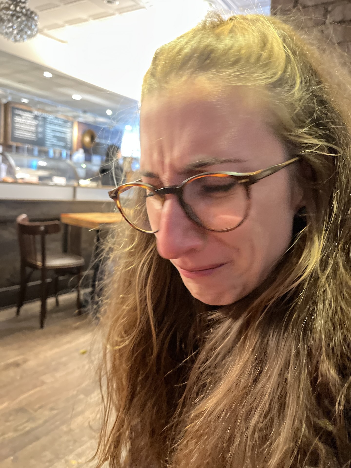 Eleonora grimacing after a sip of coffee next to the Boston Commons.